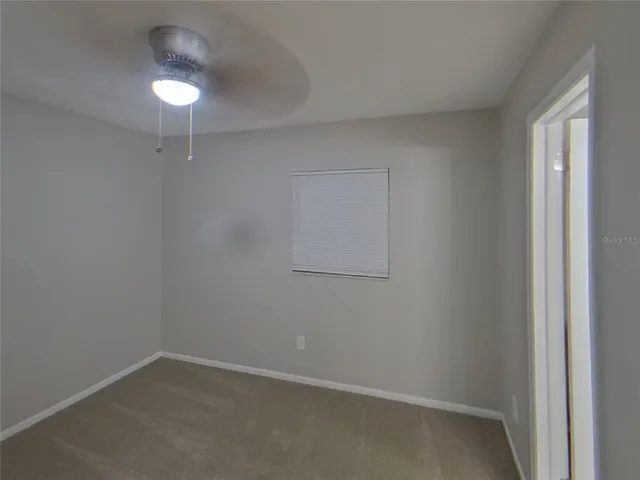 an empty room with a empty space and window