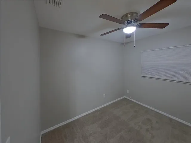 an empty room with fan