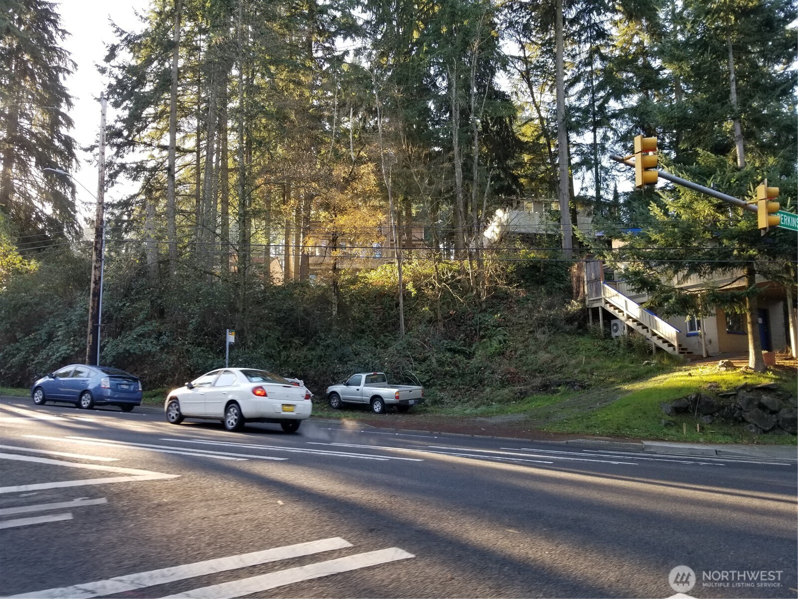 18817 15th Avenue Northeast Shoreline, WA 98155 - Photo 2 of 5 a view of a cars parked on the side of a street