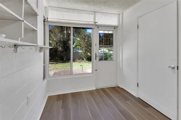 a view of room with window and hardwood floor