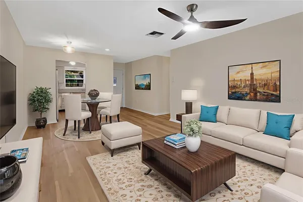 a living room with furniture and a flat screen tv