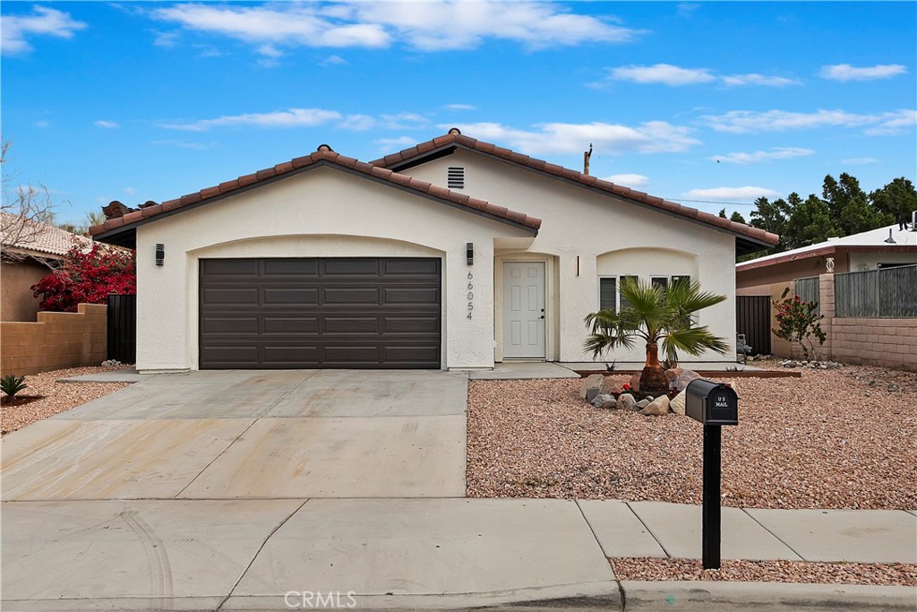 a front view of house with garage