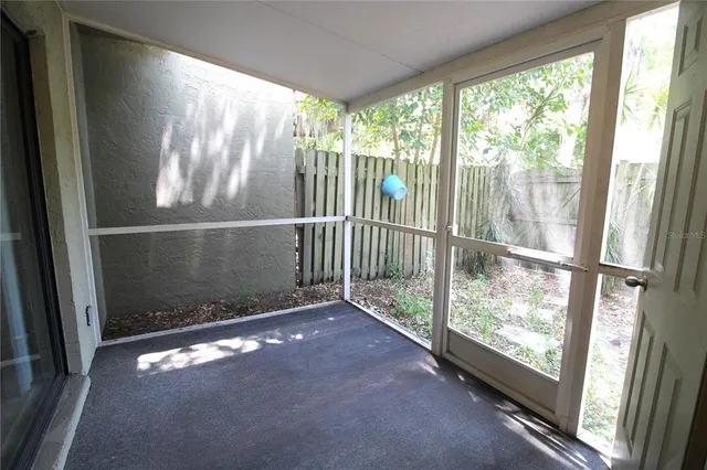 a view of a glass door with a yard