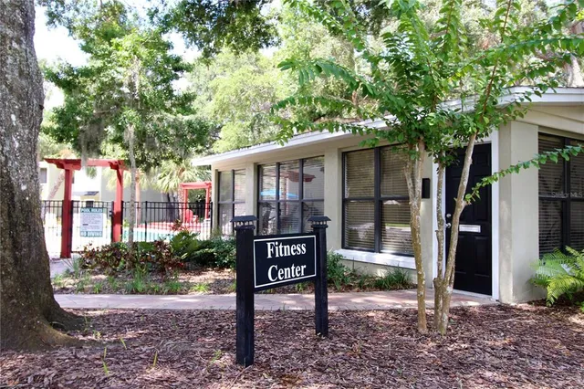 a view of a house with backyard porch and sitting area