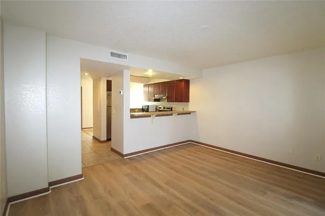 a view of a kitchen with a sink and an oven