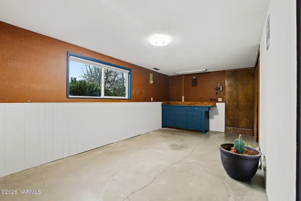 a view of an empty room with a chair