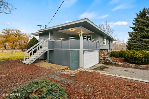 a house with trees in front of it