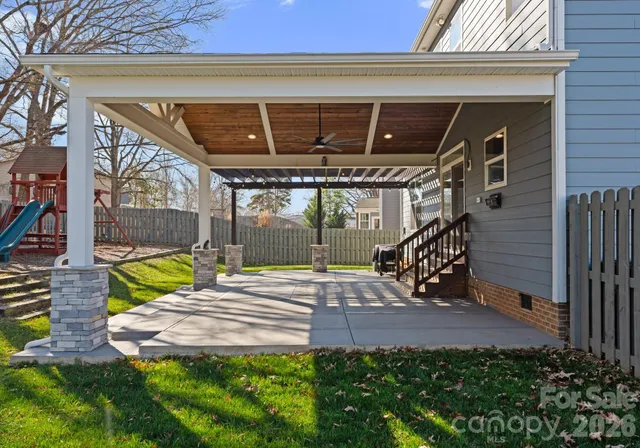 a view of yard with patio