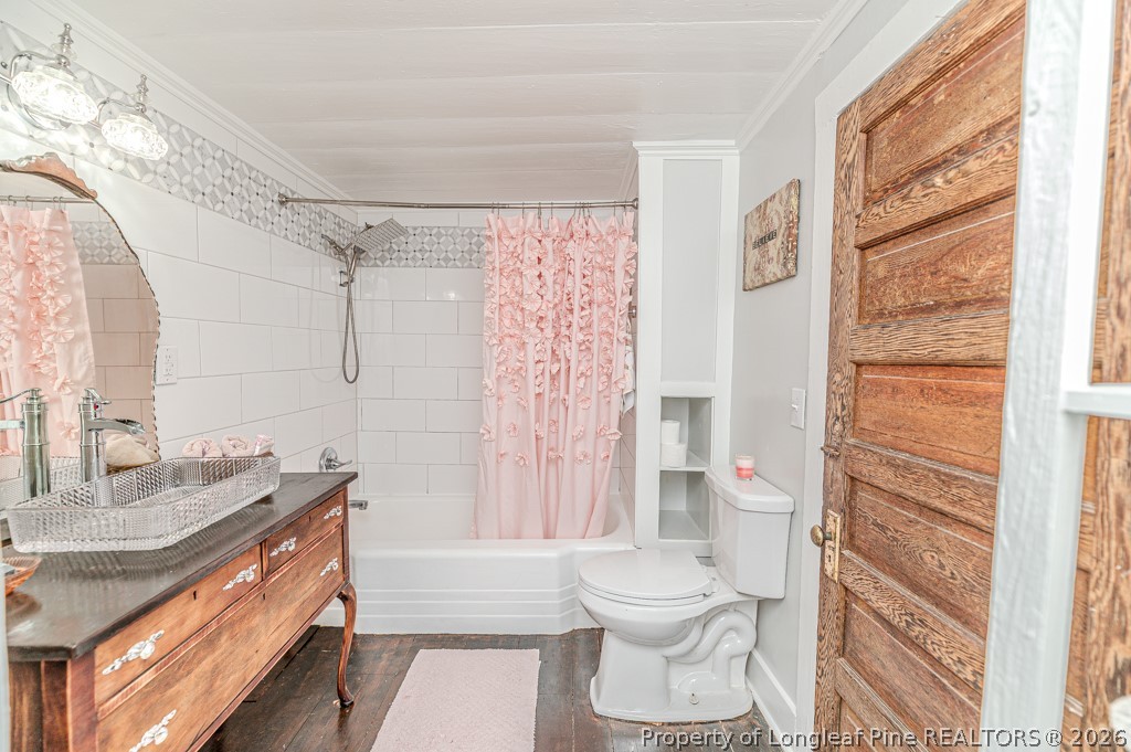 509 Carthage Street Cameron, NC 28326 - Photo 15 of 43 a bathroom with a granite countertop sink toilet and shower