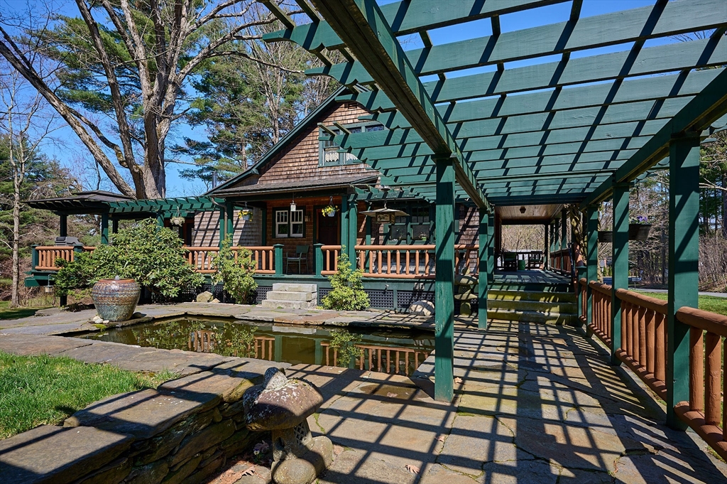27 Heatherstone Road Amherst, MA 01002 - Photo 3 of 42 a view of house with backyard porch and furniture