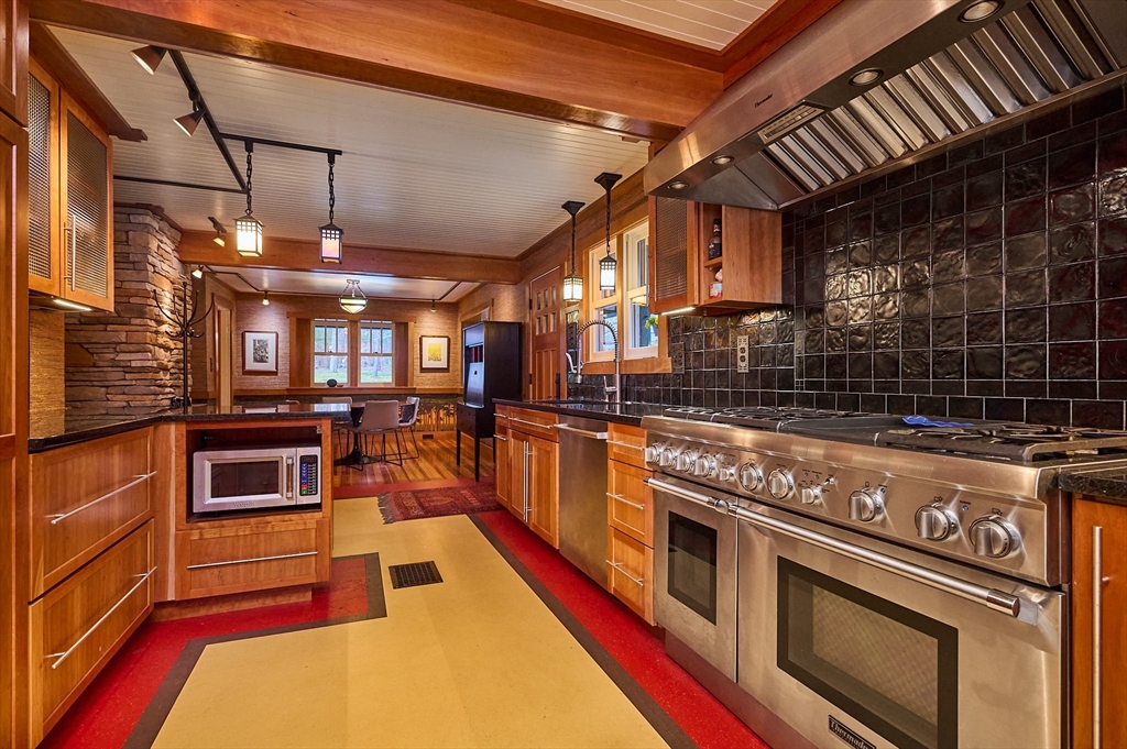 27 Heatherstone Road Amherst, MA 01002 - Photo 8 of 42 a kitchen with stainless steel appliances granite countertop a stove and a sink