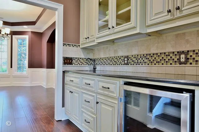 a kitchen with granite countertop stainless steel appliances and wooden cabinets