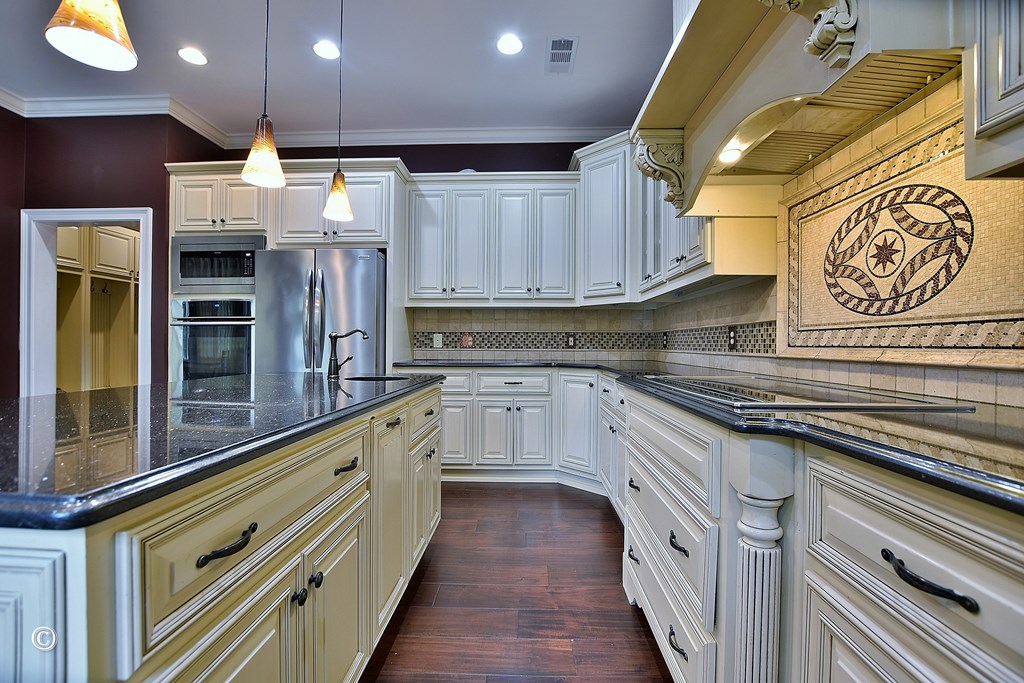 50 Grizzly Court Fortson, GA 31808 - Photo 14 of 59 a kitchen with stainless steel appliances granite countertop a sink and cabinets