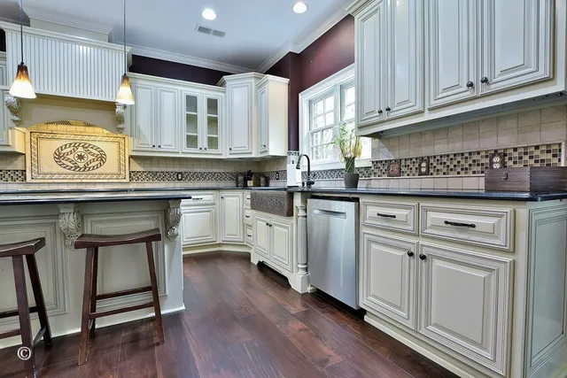 a room with wooden floors table and chairs