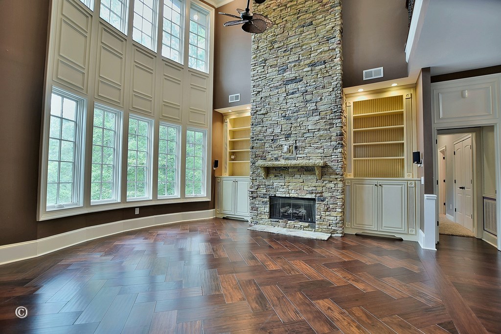 50 Grizzly Court Fortson, GA 31808 - Photo 19 of 59 a view of empty room with fireplace and wooden floor