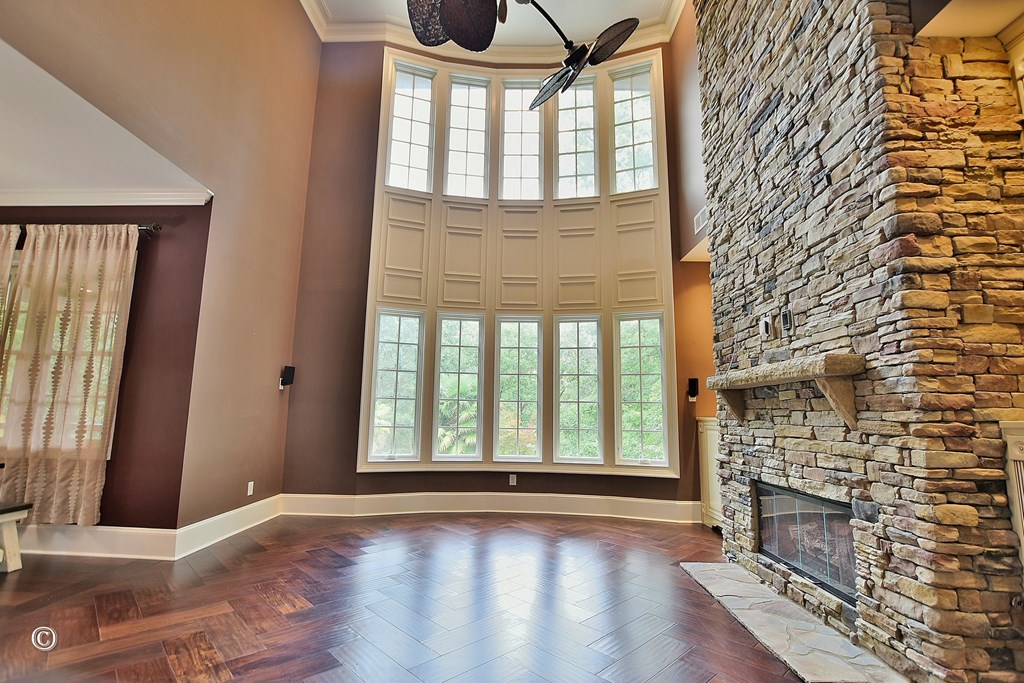 50 Grizzly Court Fortson, GA 31808 - Photo 20 of 59 wooden floor in an empty room with a fireplace