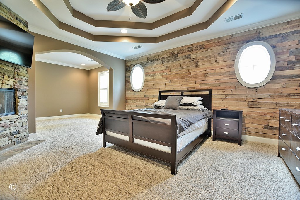 50 Grizzly Court Fortson, GA 31808 - Photo 29 of 59 a bedroom with a bed and a chandelier