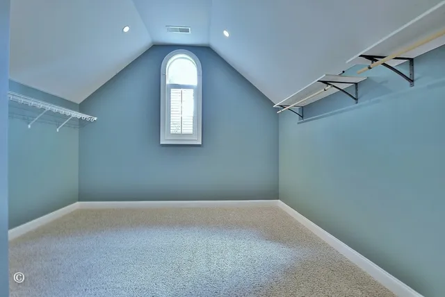 a bathroom with a granite countertop sink a mirror and shower