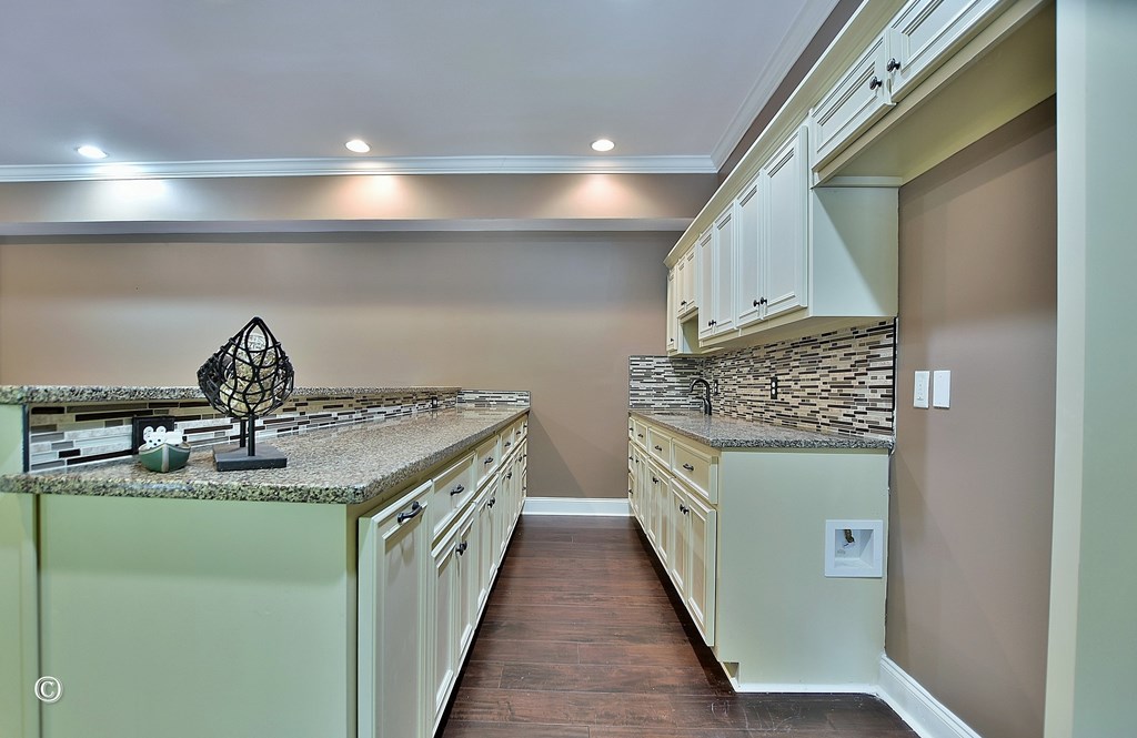 50 Grizzly Court Fortson, GA 31808 - Photo 45 of 59 a kitchen with a stove and a sink