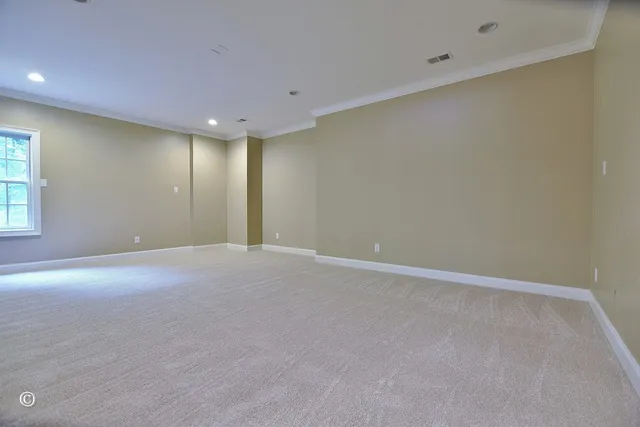 an aerial view of a house with a yard and trees