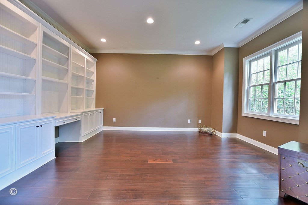 50 Grizzly Court Fortson, GA 31808 - Photo 8 of 59 a view of an empty room with a window and wooden floor