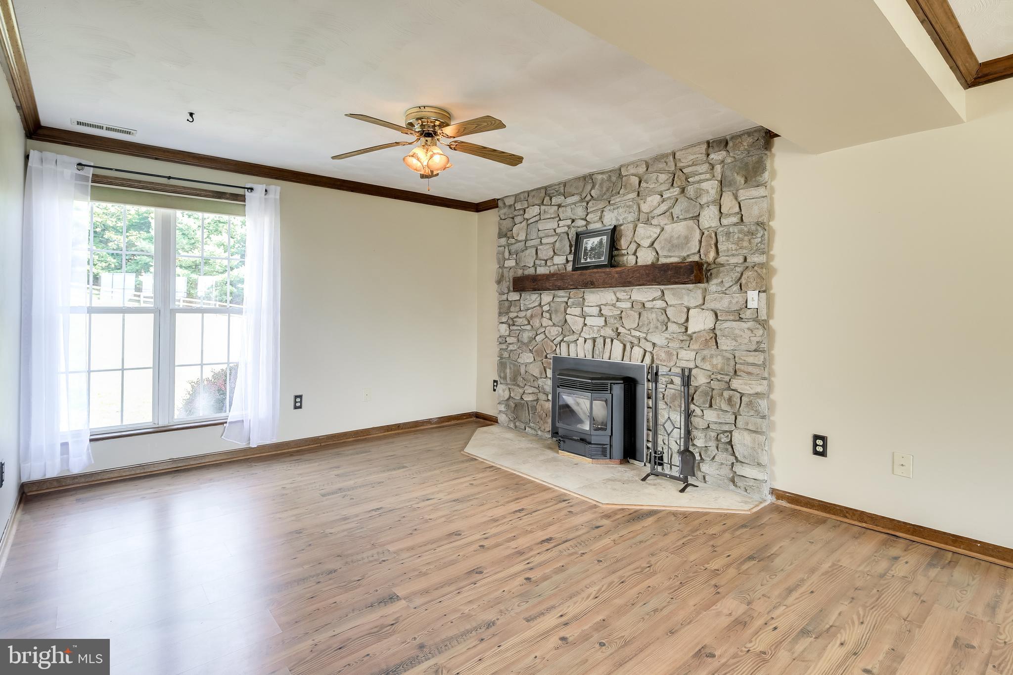 21613 Mt Lena Road Boonsboro, MD 21713 - Photo 16 of 39 Great room stone fireplace w/pellet stove insert.
