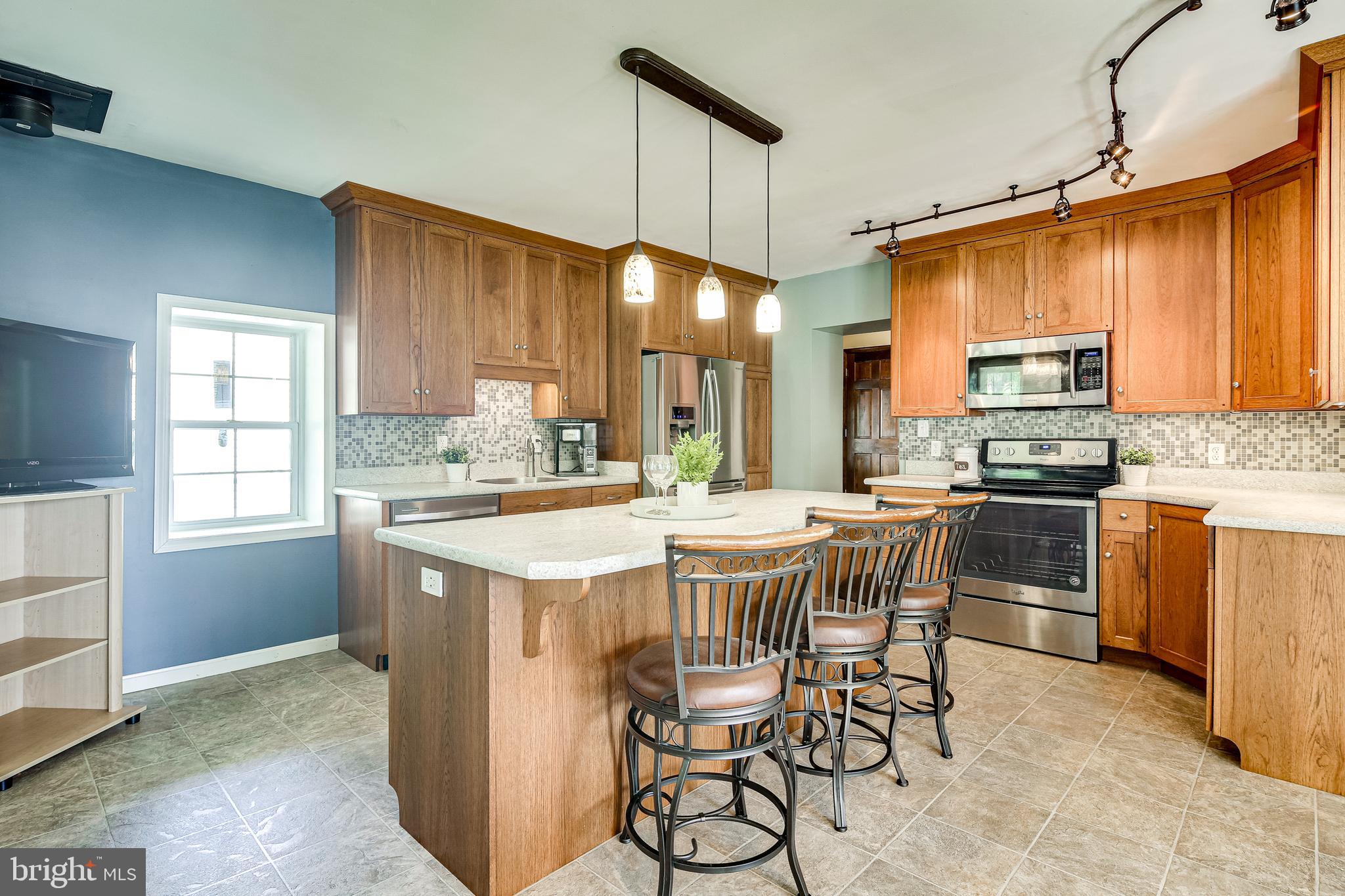 21613 Mt Lena Road Boonsboro, MD 21713 - Photo 9 of 39 2 custom built-in spice rackets & bread drawer.
