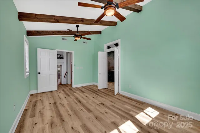 a view of room with a ceiling fan