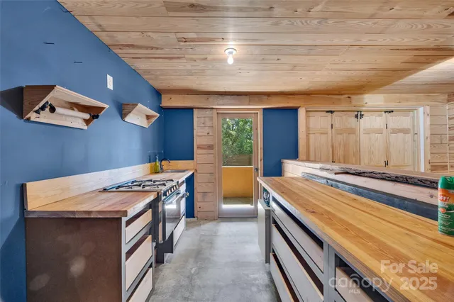 a kitchen that has a sink and a stove