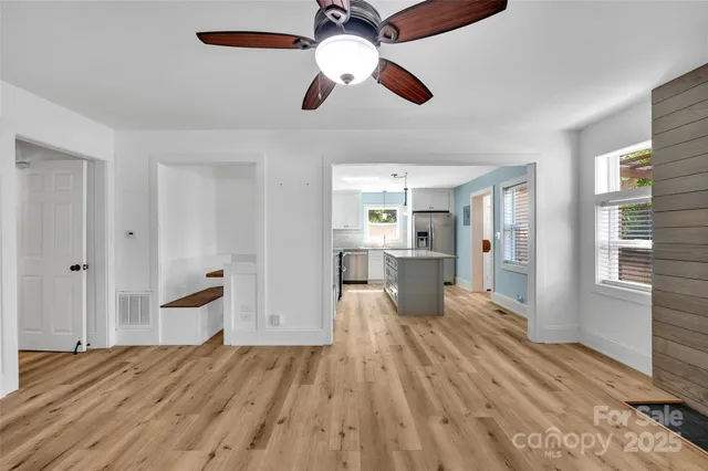 a view of a living room with wooden floor