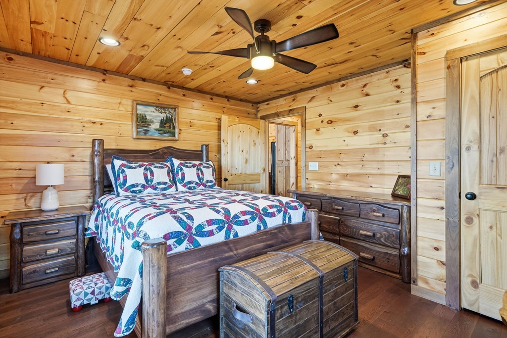 175 Stuart Drive Mineral Bluff, GA 30559 - Photo 22 of 45 a bedroom with a bed and wooden floor