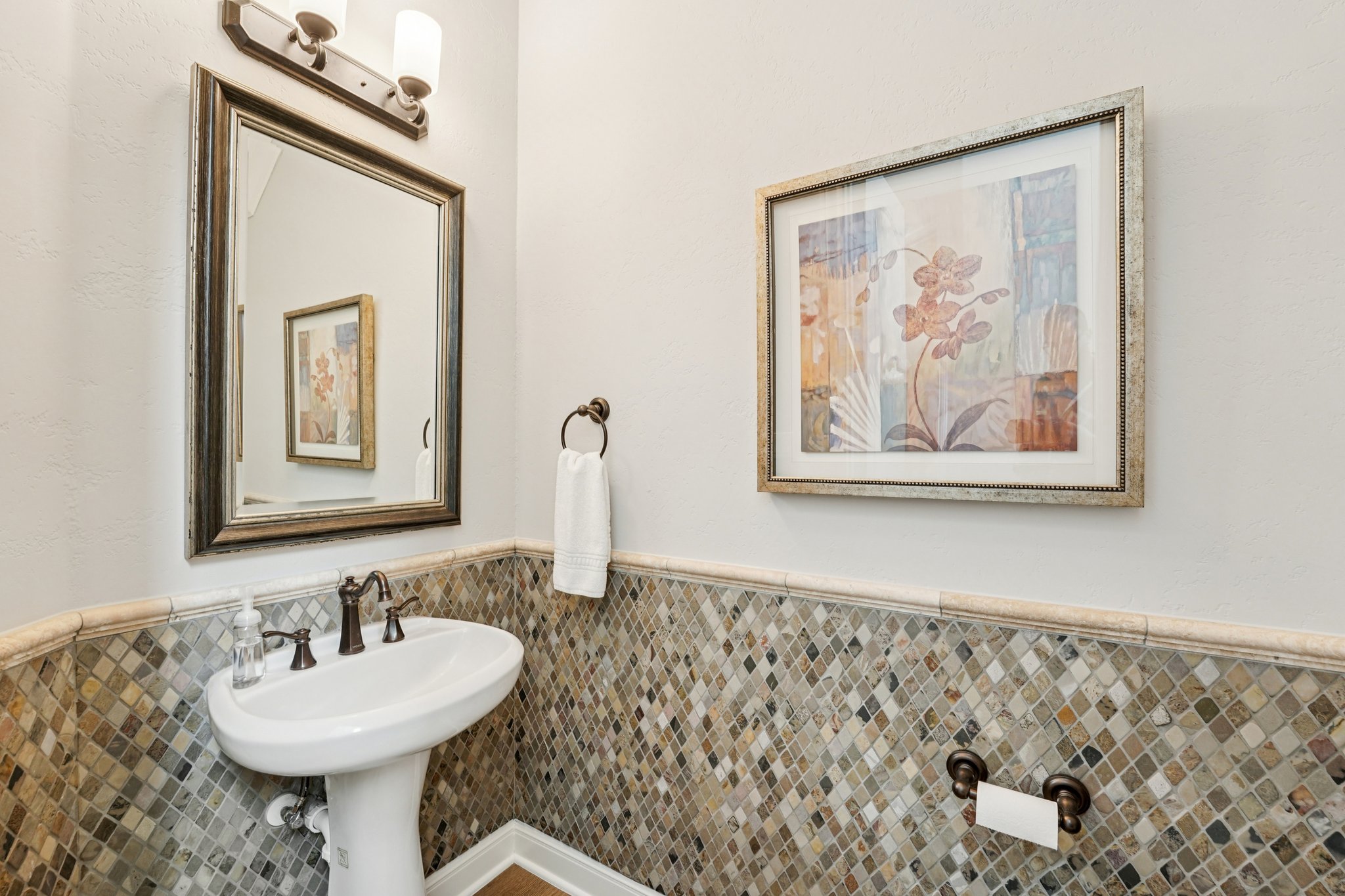 11613 Shadestone Terrace Austin, TX 78732 - Photo 22 of 35 a bathroom with a sink and a mirror