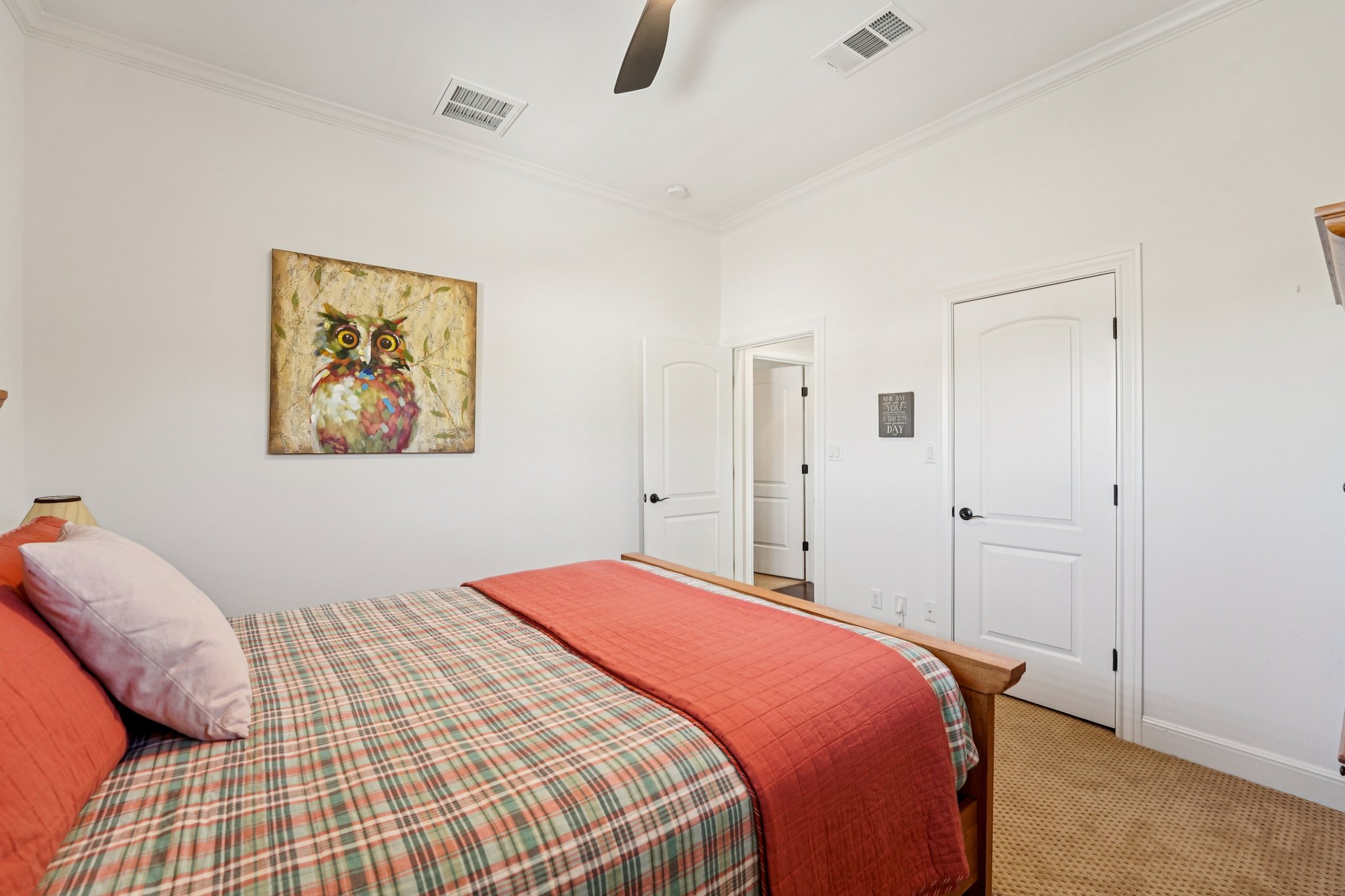 11613 Shadestone Terrace Austin, TX 78732 - Photo 23 of 35 a bedroom with a bed and painting on the wall