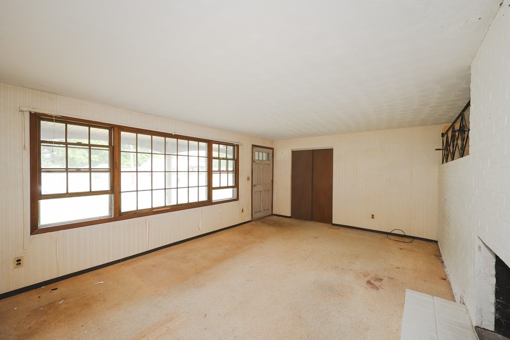 27 Trinity Street Danvers, MA 01923 - Photo 12 of 19 an empty room with a empty space and windows