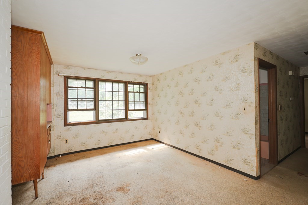 27 Trinity Street Danvers, MA 01923 - Photo 14 of 19 an empty room with a empty space and windows