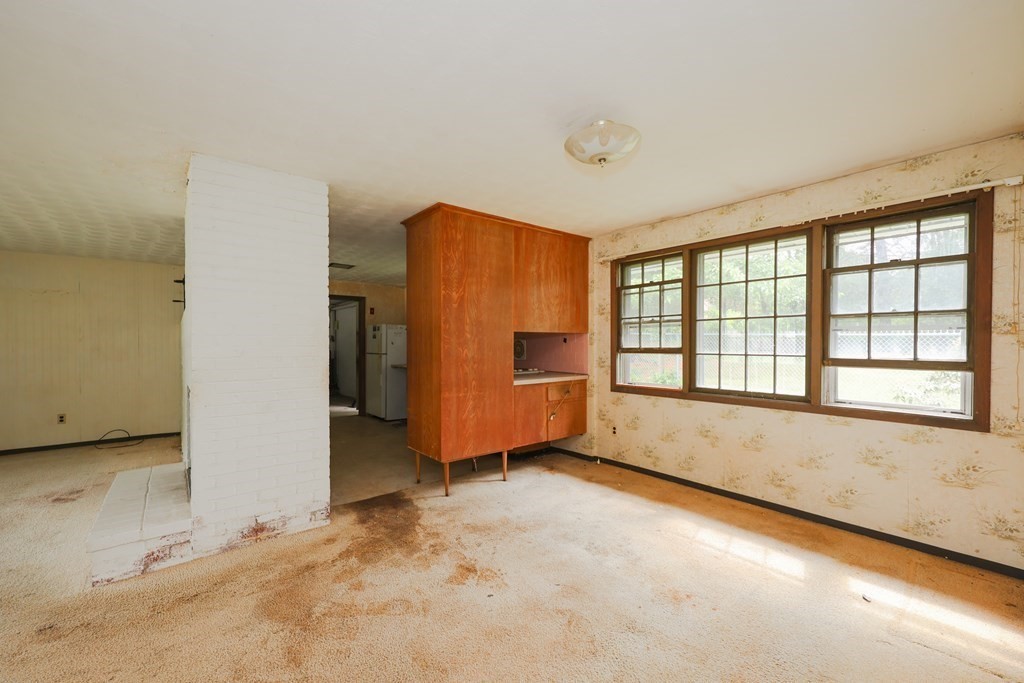 27 Trinity Street Danvers, MA 01923 - Photo 15 of 19 an empty room with a empty space and windows