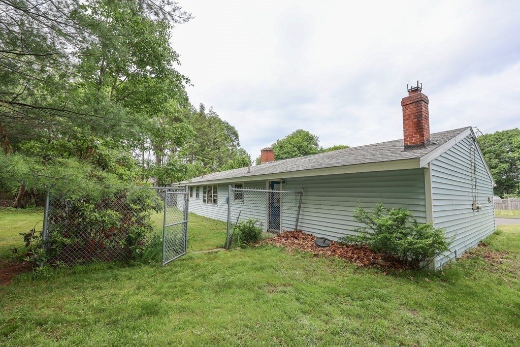 27 Trinity Street Danvers, MA 01923 - Photo 2 of 19 a front view of a house with garden