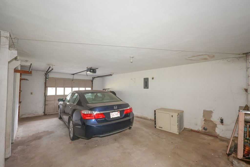 27 Trinity Street Danvers, MA 01923 - Photo 7 of 19 a car parked in a garage