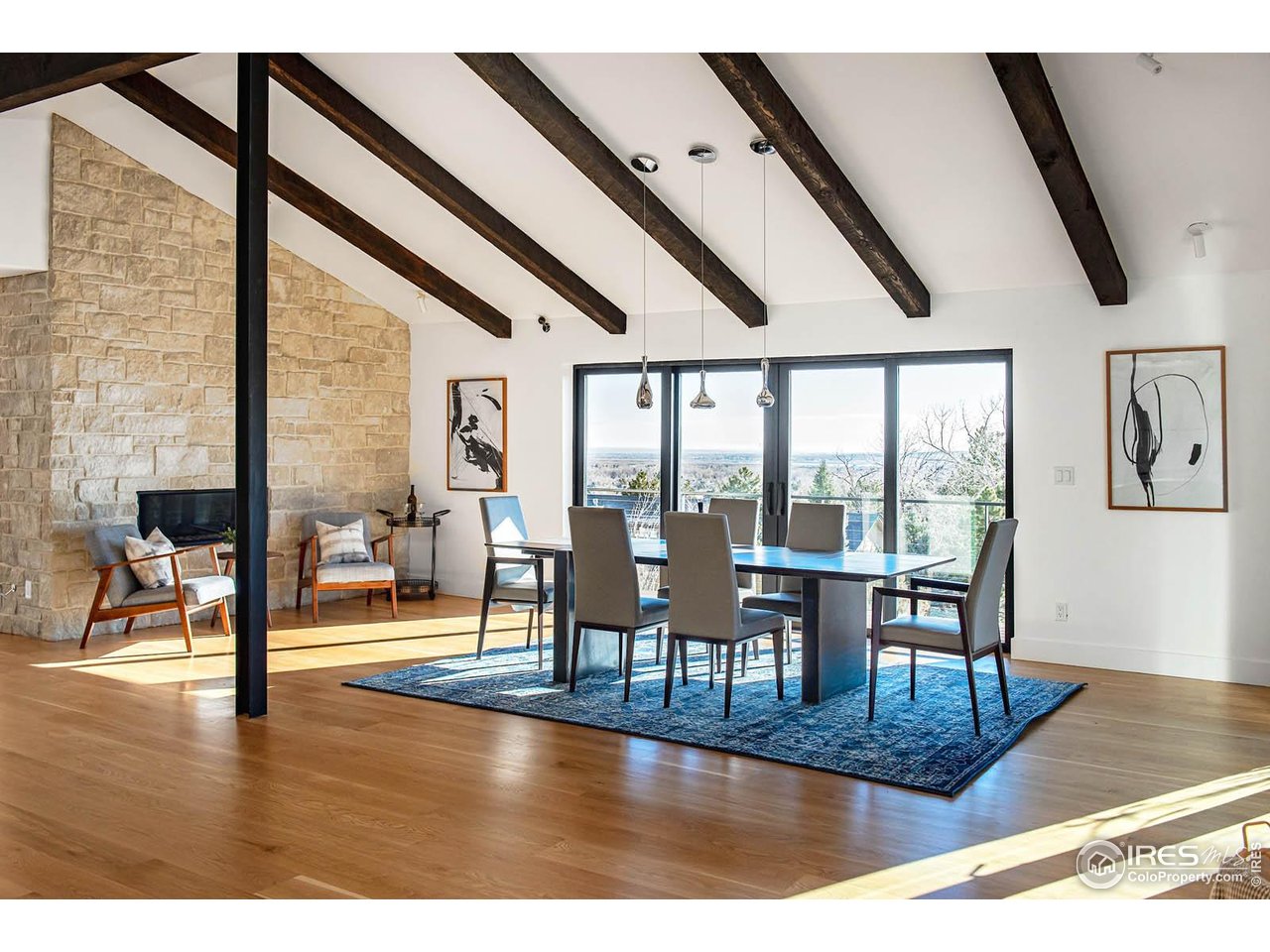 210 Cactus Court Boulder, CO 80304 - Photo 19 of 50 a dining room with wooden floor glass table and chairs