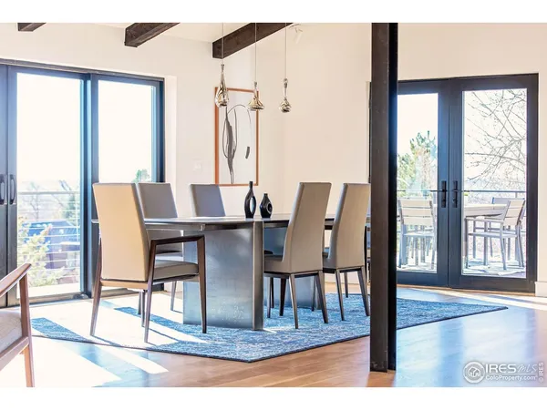 a bedroom with a bed and a balcony view