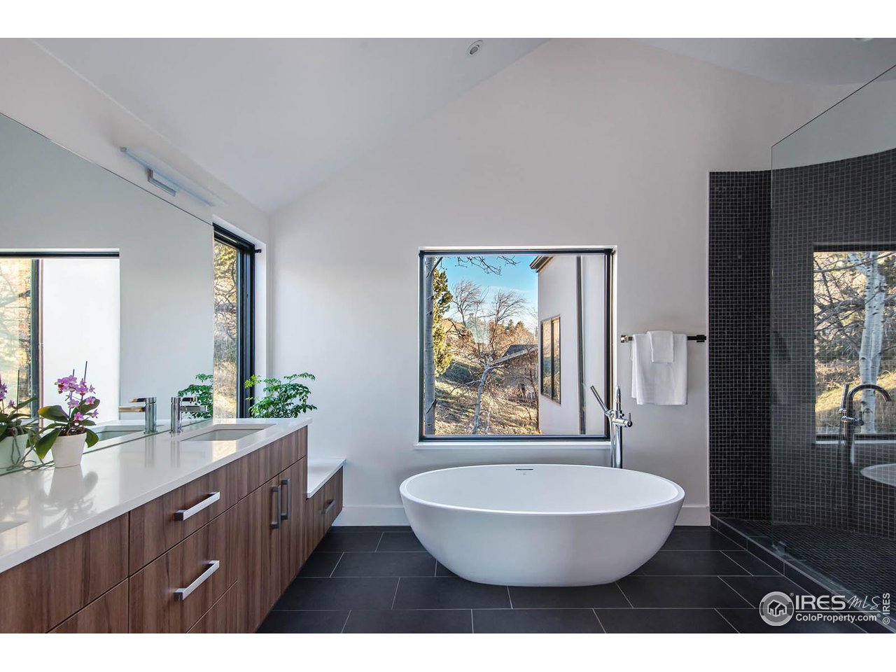 210 Cactus Court Boulder, CO 80304 - Photo 29 of 50 Primary luxury bathroom with large shower, soaking tube and views of the hillside