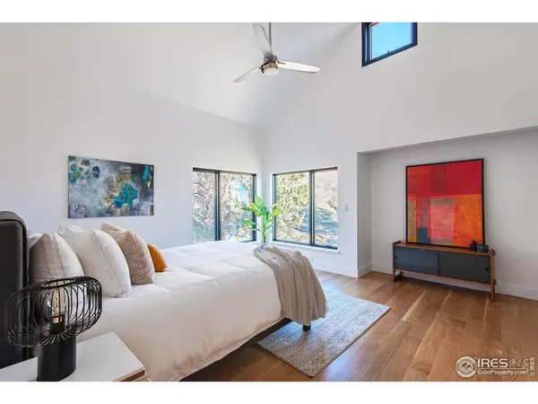 a bedroom with a bed and a couch