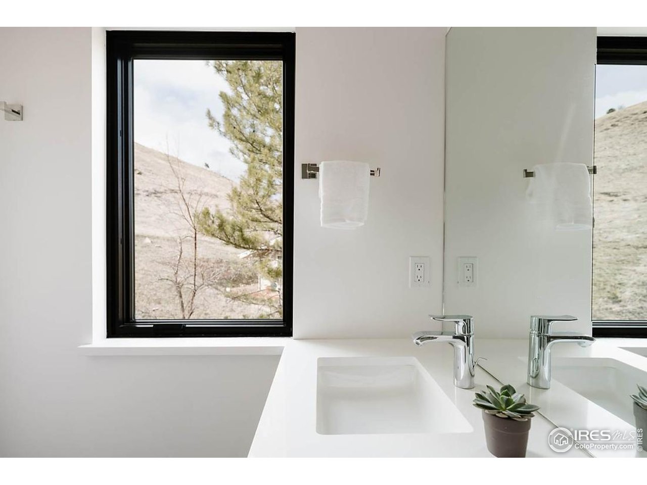 210 Cactus Court Boulder, CO 80304 - Photo 37 of 50 View from secondary bedroom bathroom to hillside and western ridge. See Para-gliders high up above, from your bathroom!