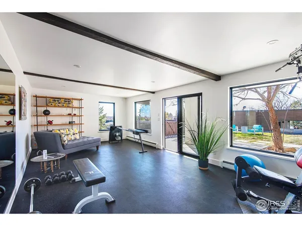 a kitchen with stainless steel appliances kitchen island granite countertop a refrigerator a stove and a sink