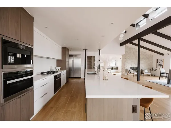 a hallway with furniture and wooden floor