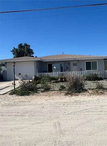 a view of house with yard and outdoor space