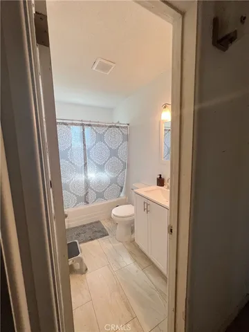 a bathroom with a glass door shower