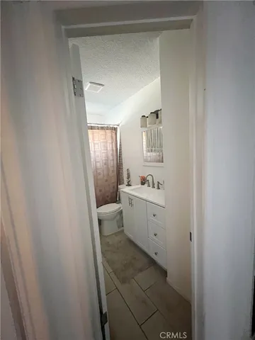 a room with a sink and a mirror