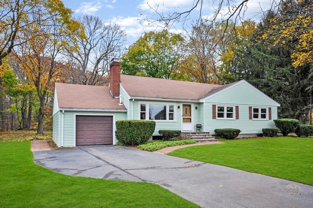 17 Cox Road Winchester, MA 01890 - Photo 1 of 19 a front view of a house with a yard and garage