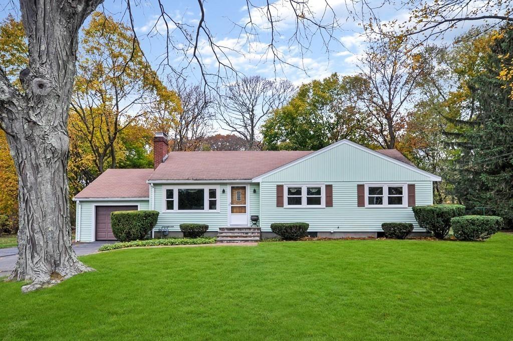 17 Cox Road Winchester, MA 01890 - Photo 17 of 19 a front view of a house with a garden and yard
